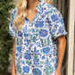 Quarter Button Round Yoke V-Neck Floral Print Top